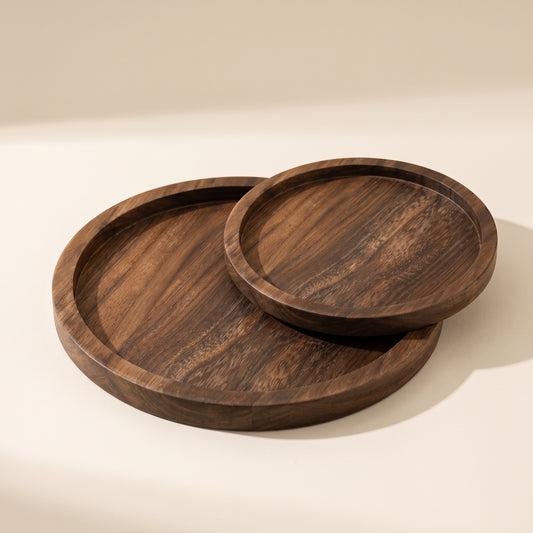 Timber™ Round Serving Tray — large and small walnut trays on warm cream background
