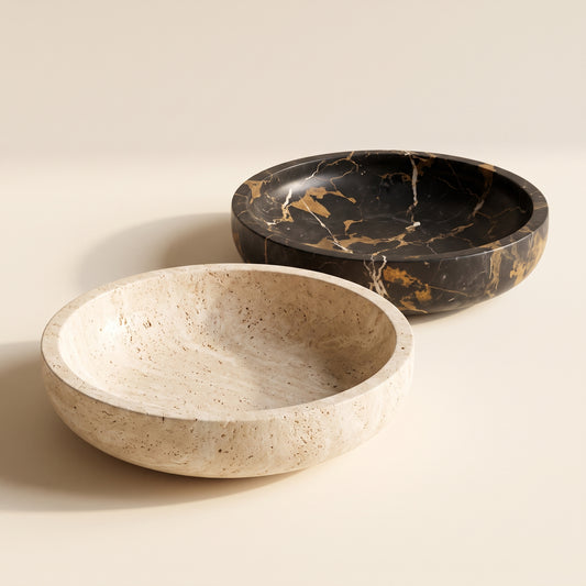 Quarry™ Marble Centerpiece Bowl — travertine and Nero Gold bowls on warm cream background