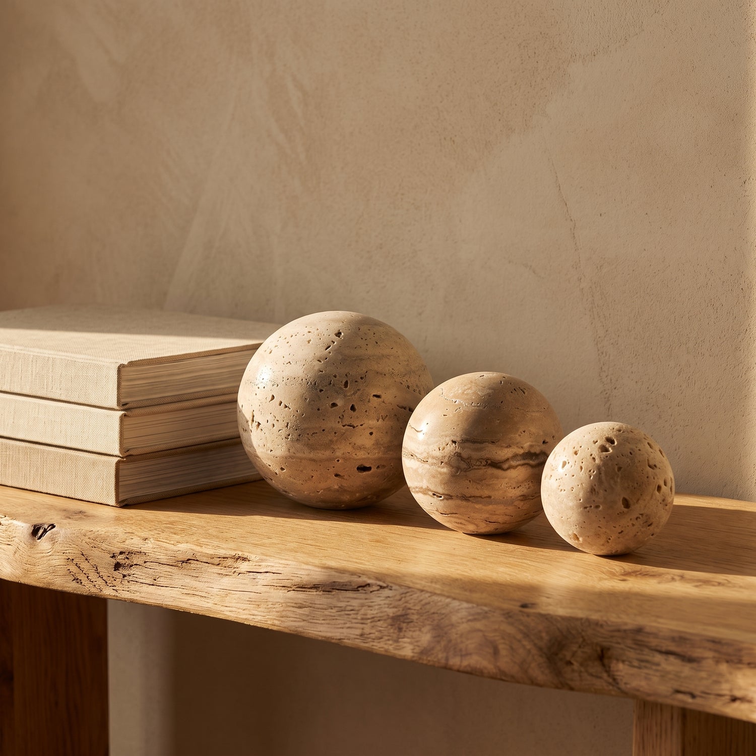 Tivoli™ Stone Spheres lined along an oak console in Kopflo style