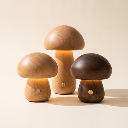 Porcini™ Mushroom Lamp — petite beech, petite walnut and tall beech lamps glowing on warm cream background