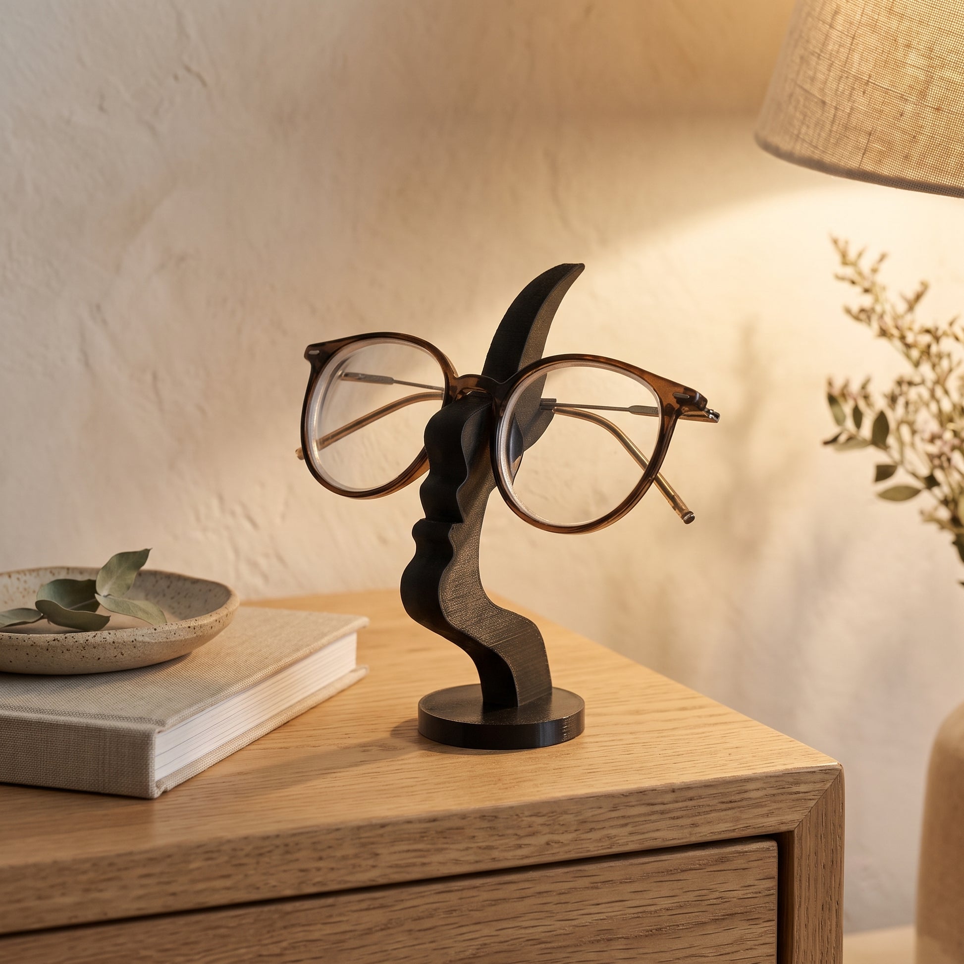 Visage™ Glasses Stand holding reading glasses on an oak nightstand in Kopflo style