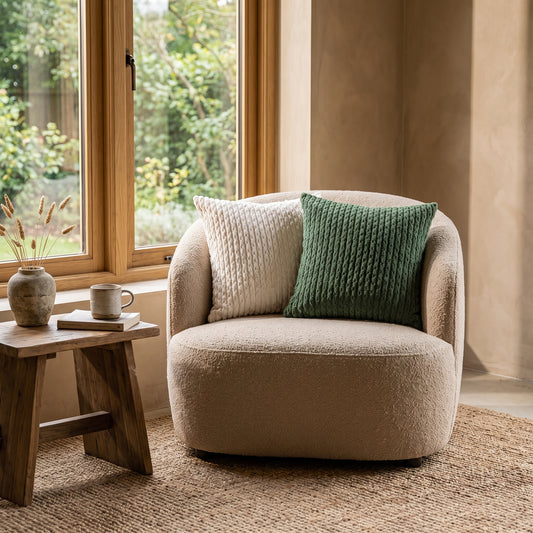 Weave™ Textured Cushion Covers on a bouclé armchair in a warm Kopflo-style reading corner