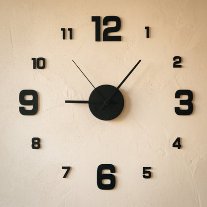 Float Clock frameless stick-on numerals and hub applied to a warm cream limewash wall