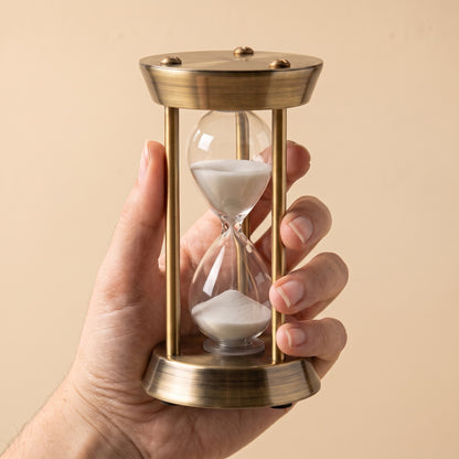 Ebb™ Sand Timer held in one hand, showing its 11 cm scale