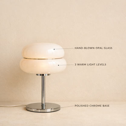 Sable lamp with labels marking the hand-blown opal glass, three warm light levels and polished chrome base