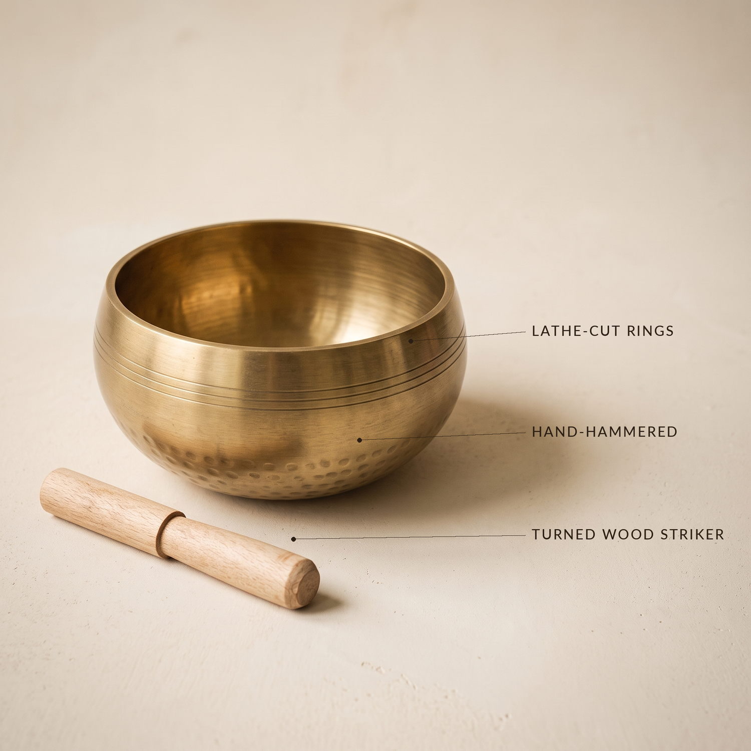 Timbre™ detail — lathe-cut rings, hand-hammered body and turned wood striker
