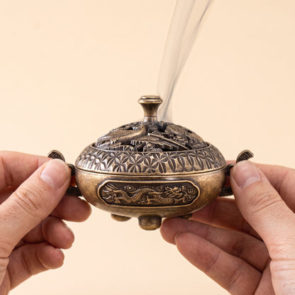 Waft™ Brass Censer held in two hands, showing its 10.3 cm scale