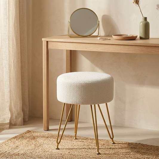Spool pulled up to a pale oak dressing table with a small brass mirror
