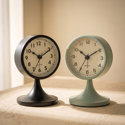 Tock™ retro alarm clocks in charcoal and sage on a warm cream surface