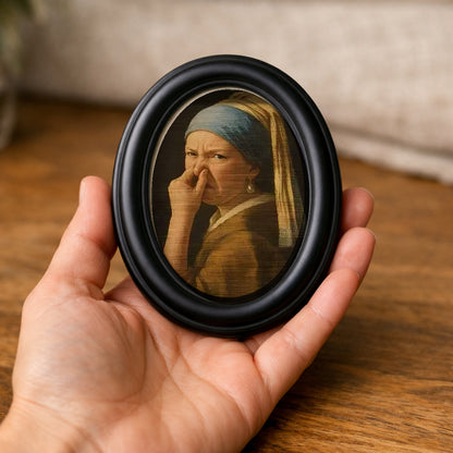 Wry Mini Portrait held in an open palm, showing how small it is